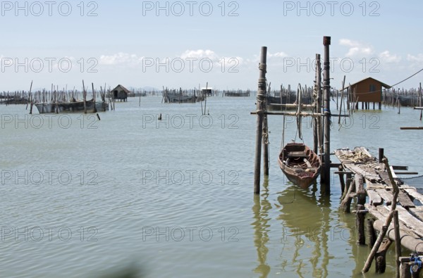 Thailand, Songkhla, Koh Yo, Aquacultural farm, Freshwater fish farming, Long-tailed boat out of