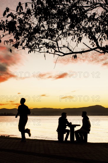 Sidewalk of Beira Mar Norte Avenue at sunset. Florianopolis, Santa Catarina, Brazil