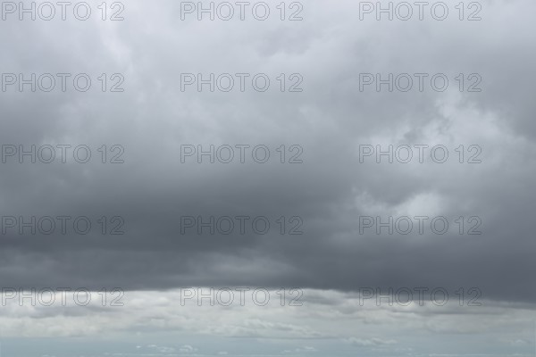 Large cloud field in front closed cloud cover from low-hanging low-hanging Nimbostratus gray
