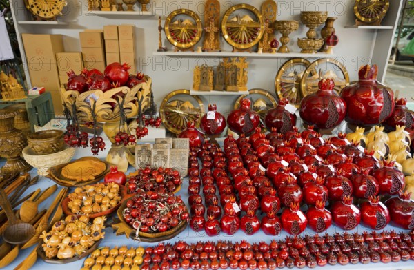 Selling red decorative pomegranate crafts on a market table, Vernissage Market, Handicraft Market,