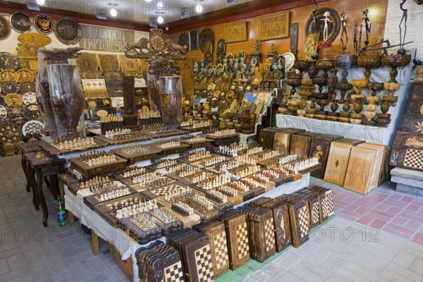 Shop with a variety of handmade wooden checkerboards and decorations, Vernissage Market, Craftsman
