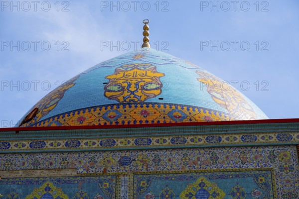 Detailed view of the richly decorated blue dome of a mosque with decorative ornaments, Blue Mosque,