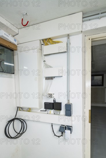 Network and communication distributor with patch panel, switch and properly routed cables, house