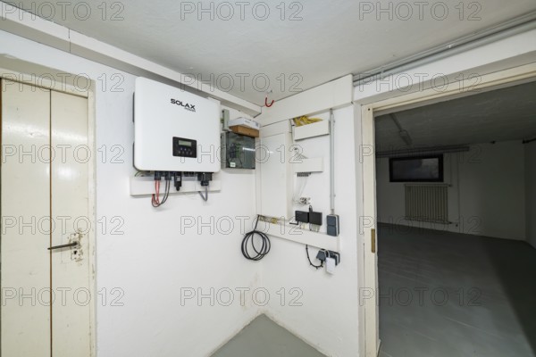 Technical room in the basement with Solax inverter and photovoltaic system installations, house