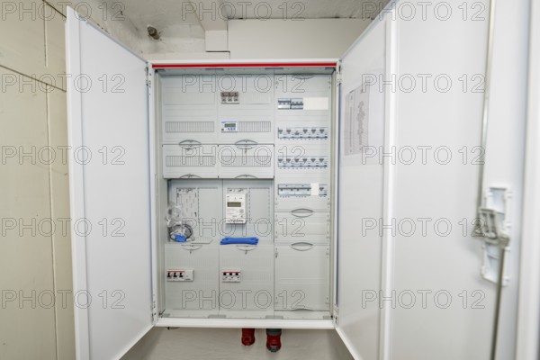 Detailed view of an opened fuse box with modular electrical distribution, house renovation,