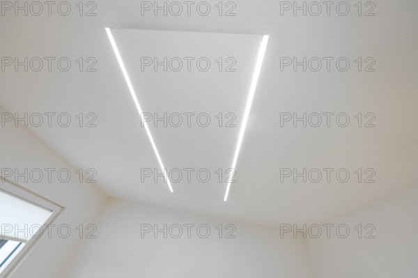 Bright ceiling with two parallel LED light strips, minimalistic design, house renovation, climate