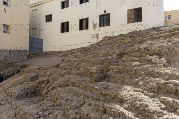 An old historic theatre in the middle of a town surrounded by houses. This landmark was