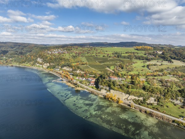 Aerial view of Lake Constance with the village of Hödingen, above Überlingen, surrounded by autumn