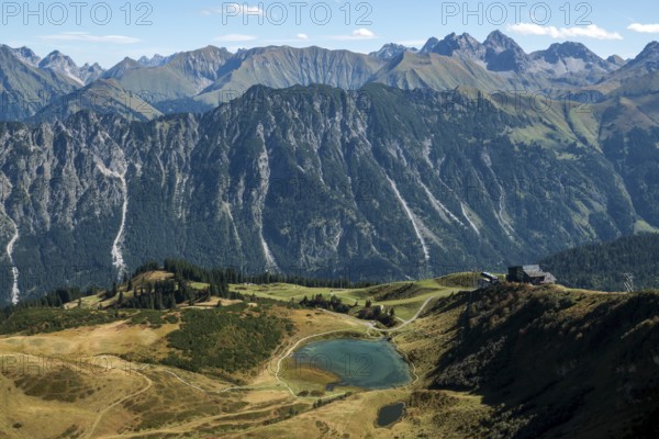 View from the Fellhorn Ridge hiking trail to Schlappoldsee and mountains of the Allgäu Alps,