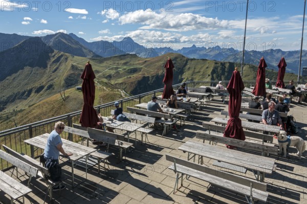Terrace of the restaurant Gipfelstation Fellhornbahn, behind mountains of the Allgäu Alps,