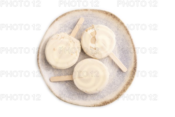 ?hocolate Ice cream in white glaze isolated on white background, top view, flat lay, close up,