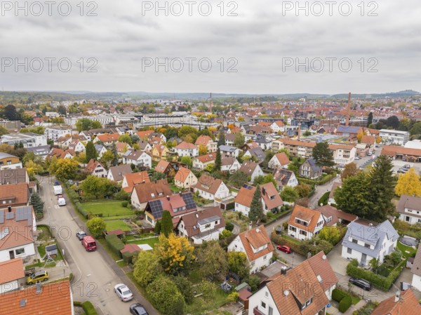 Quiet residential area in autumn seen from above under grey skies, Metzingen, Germany