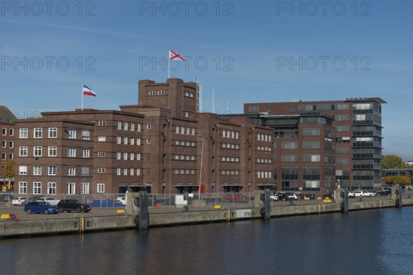 Former warehouse in the port of Kiel, apartments, services, red brick building, architecture, quay,