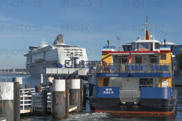 Fjord liner docks, ferry and cruise ship Color Magic of the Norwegian Color Line, Kiel port, car