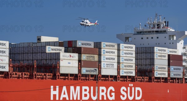 Container ship from the shipping company Hamburg Süd Santa Rita with container leaving the Indian