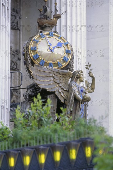 Angel figure with big clock at the upscale department store Selfridge, Oxford Street, London,