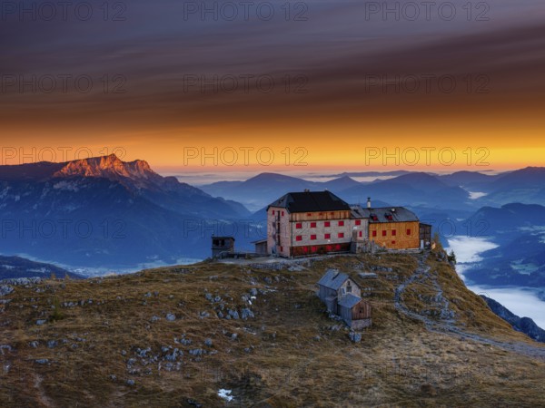 Watzmannhaus at sunrise, fog in the valley, Untersberg on the left in first sunlight, Berchtesgaden
