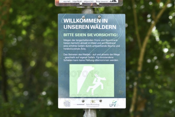 Mannheim, Germany - August 31st 2025: Warning sign at entrance of Dossenwald forest about danger of