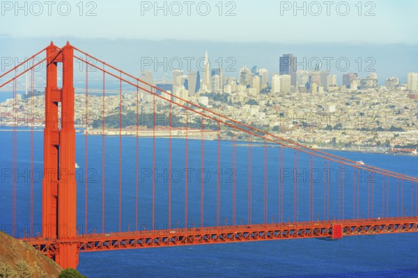 View of Golden Gate Bridge and financial district in the distance, San Francisco, California, USA