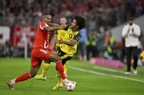 Duel, action Jonathan Tah FC Bayern Munich FCB (04) against Karim Adeyemi Borussia Dortmund BVB