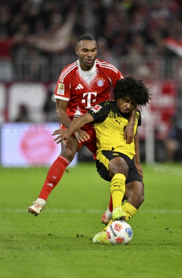 Duel, action Jonathan Tah FC Bayern Munich FCB (04) against Karim Adeyemi Borussia Dortmund BVB