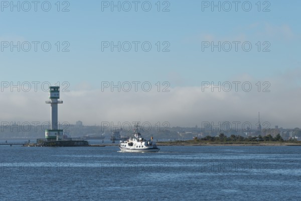 Green-white lighthouse Friedrichsort with city panorama of the state capital, Kiel Fjord, Kiel,