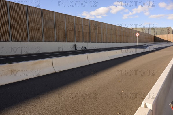 A man urinates next to his bicycle on the A100 during the bicycle demo on the recently inaugurated