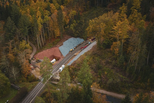 Railway tunnel construction in an autumn forest environment seen from the air, Hermann-Hesse-Bahn