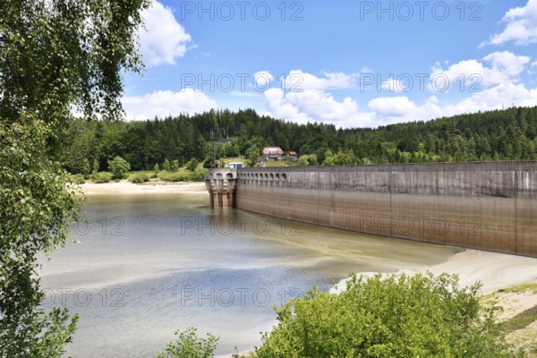 Dam at lake in the Black Forest in Forbach in Germany called Schwarzenbach Reservoir under a clear