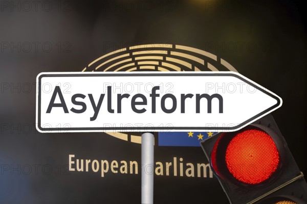 (photo montage) Directional arrow with the inscription ASYLUM REFORM in front of the European Union