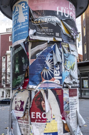 Advertising column for cultural projects, advertising for events, unkempt, torn and exfoliated