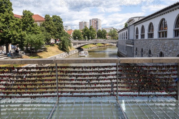 Love locks hang in several rows on the railing of the Mesarski Most (butcher's bridge) over the