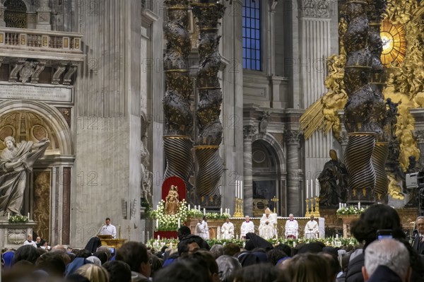 View of heads of faithful in the foreground at the bottom of the picture Pope Saint Father with