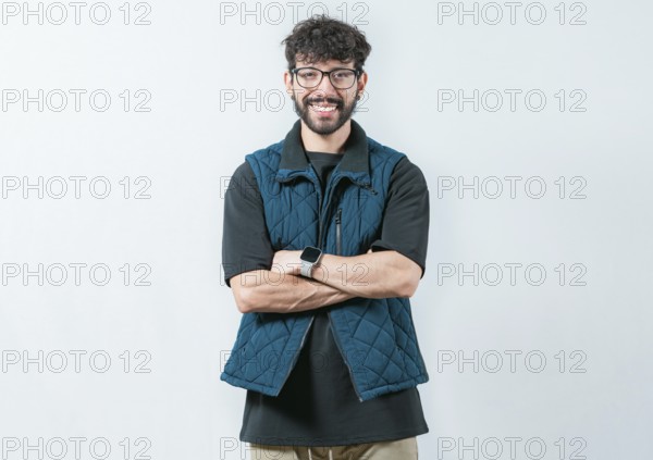Portrait of cool and handsome casual man with glasses and crossed arms. Smiling and handsome guy