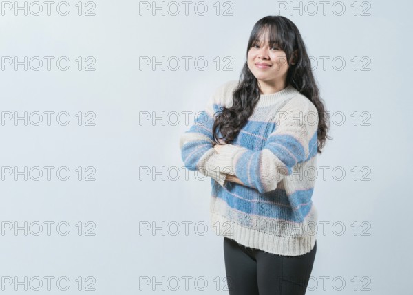 Portrait of beautiful and smiling Asian woman on isolated background. Young Asian female with