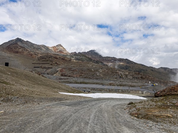 Alpine mountain landscape with covered snowfields at the valley station of the Tiefenbach cable car