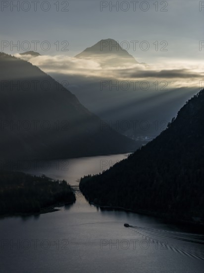 Mountain lake, mountains, sunrays, back light, fog, boat, sightseeing boat, evening light, Plansee,