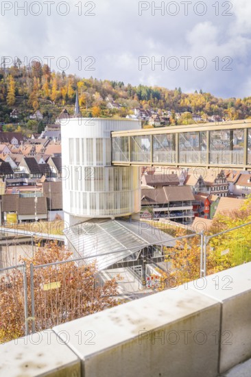 Autumn cityscape with a modern building and hill in the background, ZOB Calw, Hermann Hessebahn,