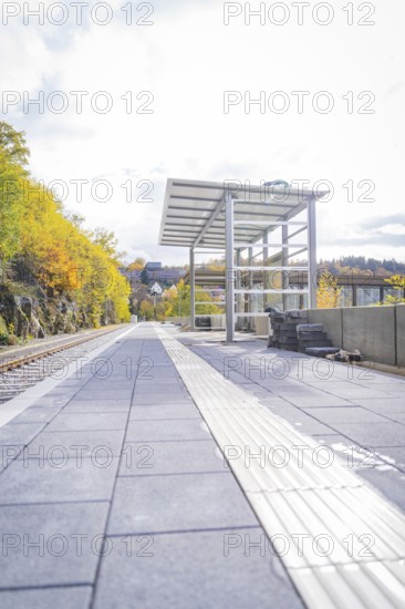 Empty train station in autumn surroundings with modern architecture and sunny weather, ZOB Calw,