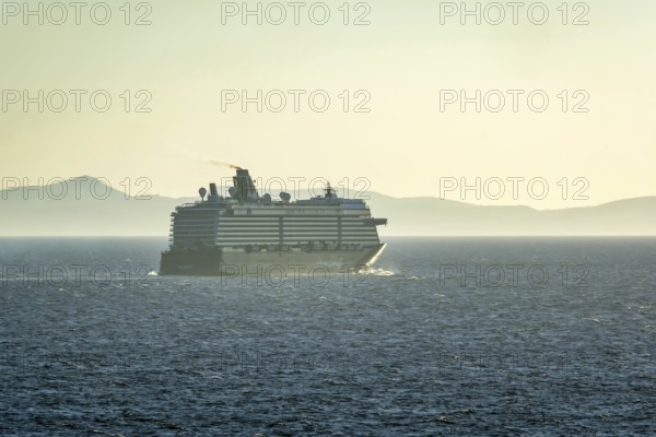Mykonos, Cyclades, Greece - Cruise ship MEIN SCHIFF 5 sails out of Mykonos harbour bay and leaves