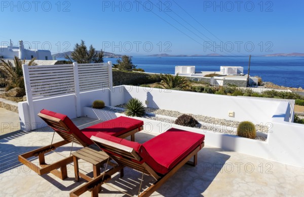 Mykonos, Cyclades, Greece - theme photo: vacation in Greece, sun loungers on the terrace of a