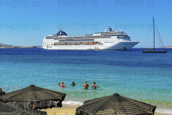 Mykonos, Cyclades, Greece - Cruise ship MSC Lirica is located in Mykonos Harbour Bay. Cruise ships