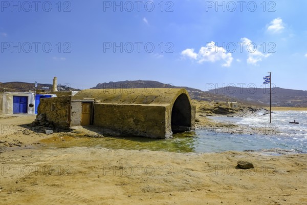 Mykonos, Cyclades, Greece - Ftelia Beach, fishing lodge on Ftelia beach, sandy beach on windy rocky