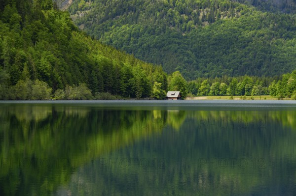Landscape of Lake Offensee after rain when the sun comes through the clouds in spring,