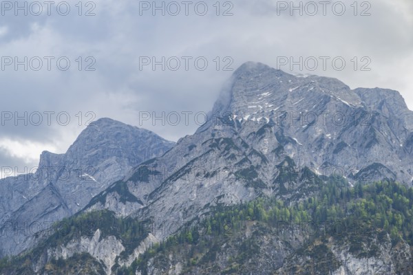 View into the mountains next to Lake Traunsee on a rainy day in spring, Traunstein summit,
