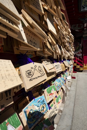 Ema, small wooden tablets with wishes and prayers, hung so that the Kami spirits or gods can