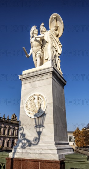The shadow of a street lamp on the pedestals of the group of figures on the Schlossbrücke, Unter