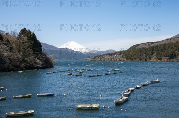 Attached rowing boats, view of Lake Ashi with Mount Fuji volcano, Hakone, Japan