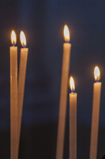 Sacrificial candles in a church, Tuscany, Italy