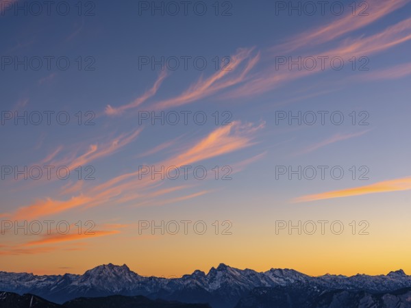 Red-colored plume clouds over the Berchtesgaden Alps at dusk, Hochstaufen, Chiemgau Alps, Upper